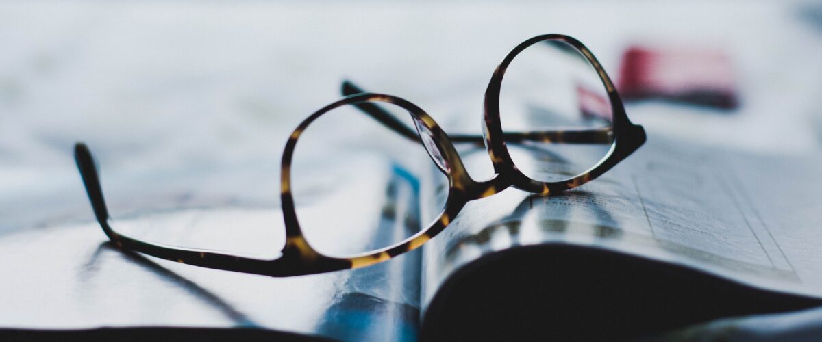 Reading glasses on a book