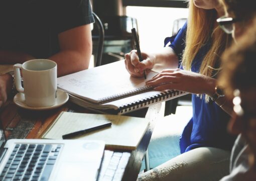 A group of people writing collaboratively