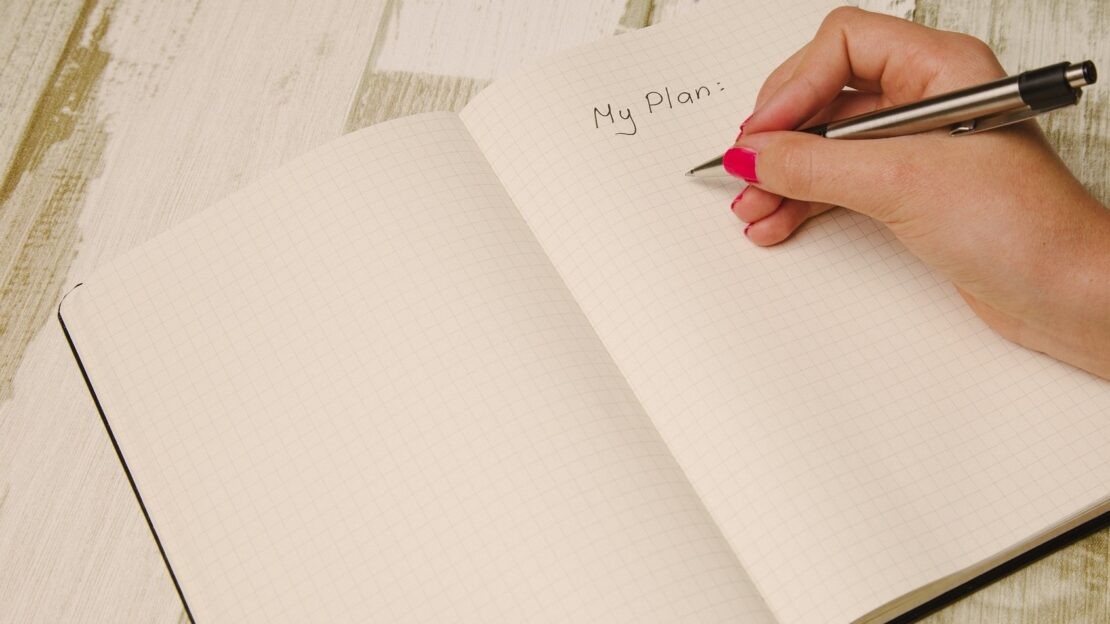 Woman writing her plan