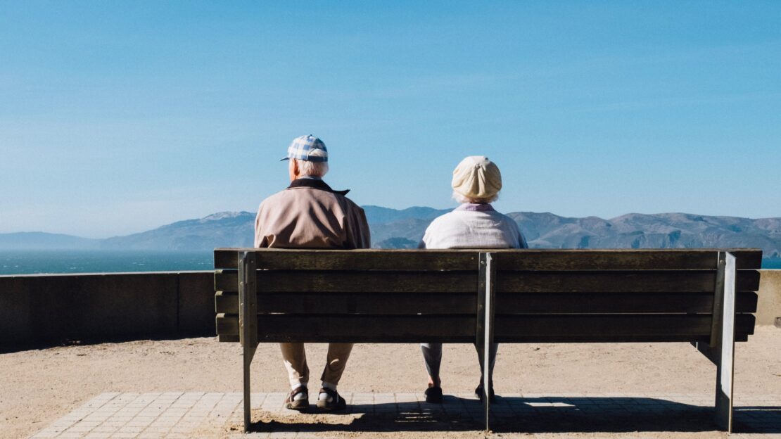 Old couple sitting on a bench