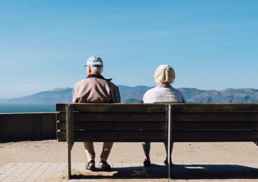 Old couple sitting on a bench