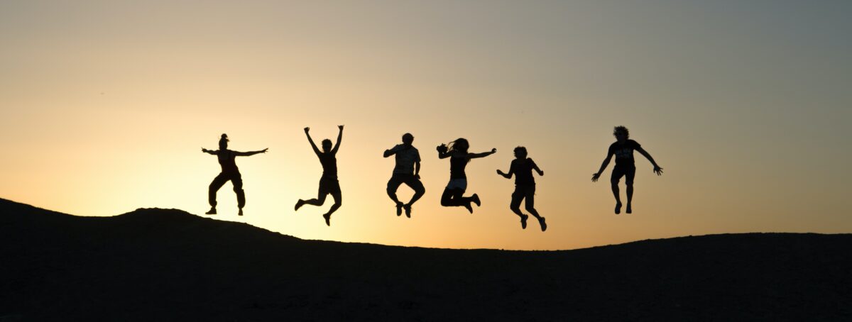 Group of people jumping for joy