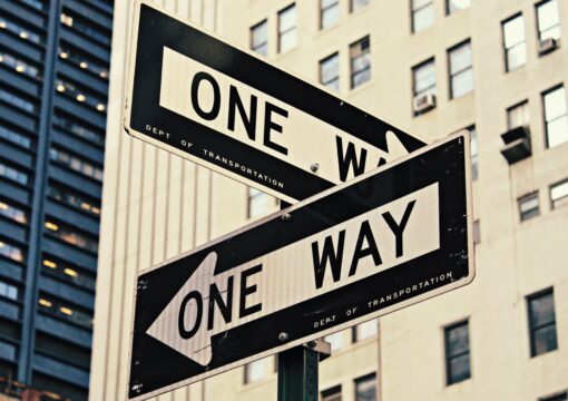 Street signs pointing in opposite directions