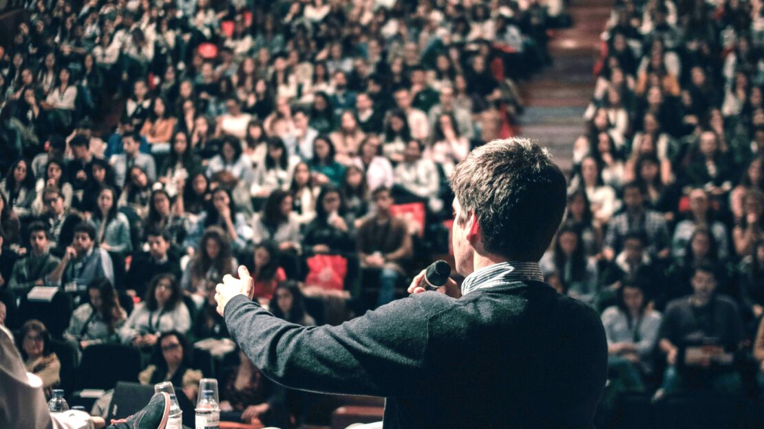 A man addressing a crowd