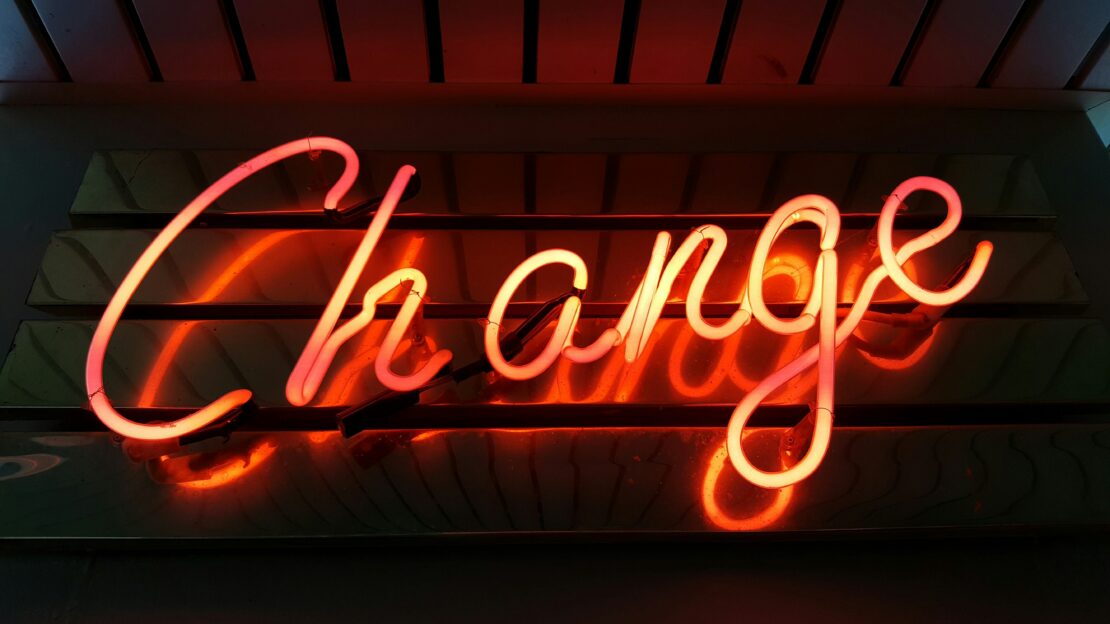 Neon sign reading 'change'